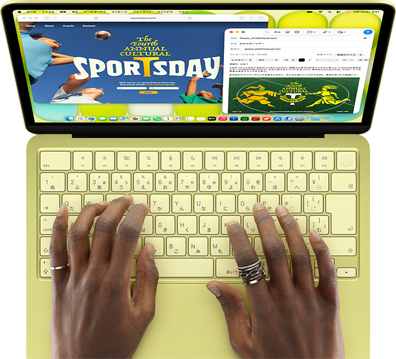 シトラスのMacBook Neo。キーボードの上に手が置かれている。ユーザーが美術展の開会への招待Eメールを作成していて、隣にそのイベントのウェブサイトが開かれている