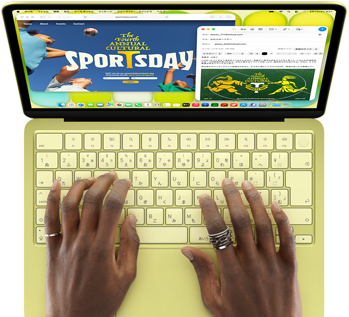 シトラスのMacBook Neo。キーボードの上に手が置かれている。ユーザーが美術展の開会への招待Eメールを作成していて、隣にそのイベントのウェブサイトが開かれている